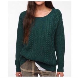 green knit sweater with elbow patches